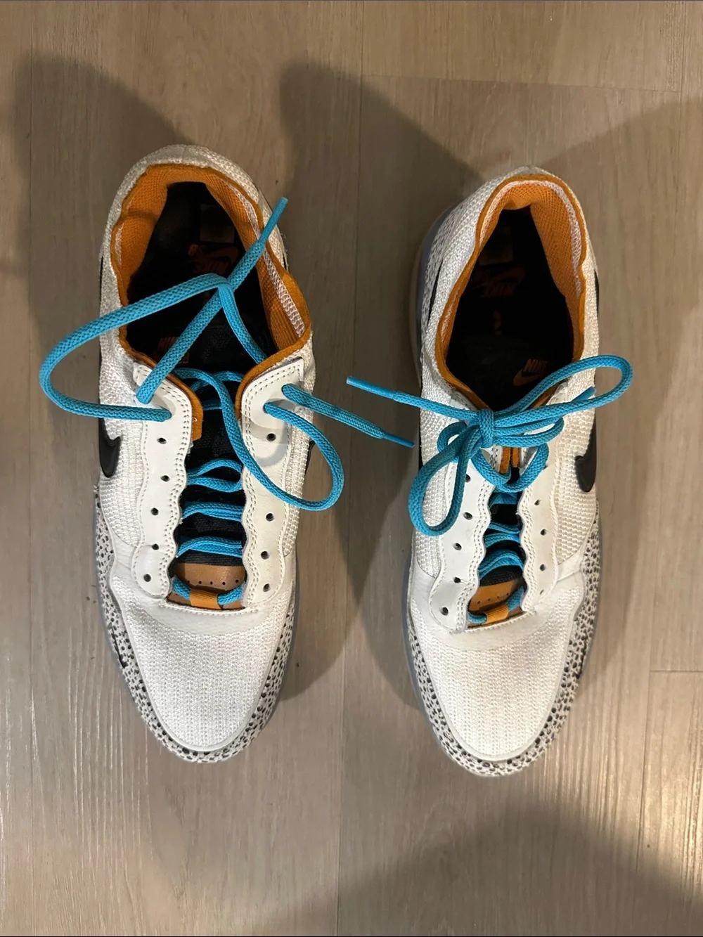 Nike Low-Top Sneakers in White with Black Swoosh and Turquoise Laces